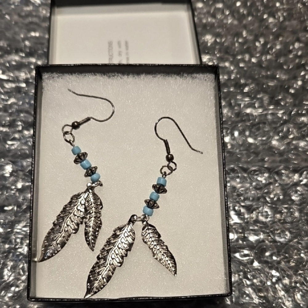 Chic Silver Feather Earrings with Turquoise Beads